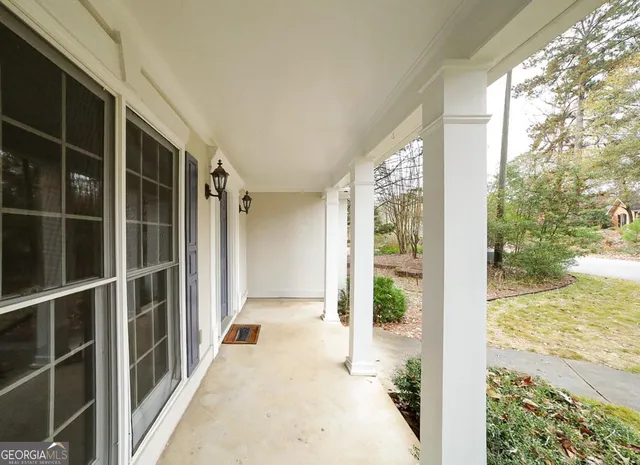 a view of balcony with wooden floor