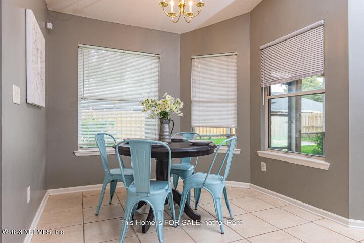 10329 Shelby Creek Road South Jacksonville, FL 32221 - Photo 20 of 41 a view of a dining room with furniture and window