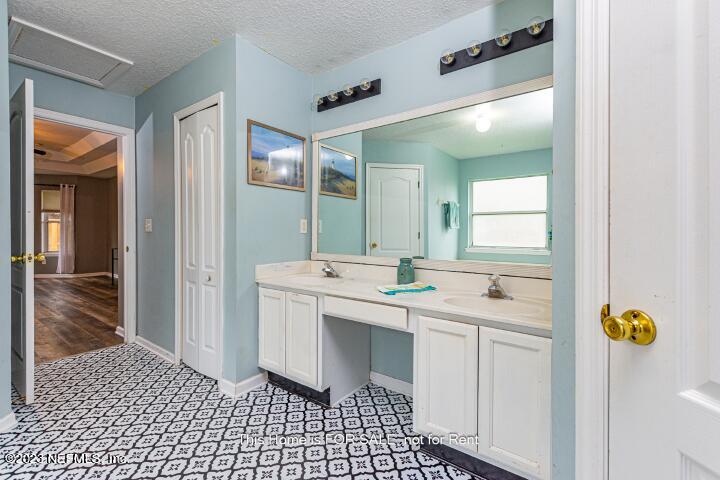 10329 Shelby Creek Road South Jacksonville, FL 32221 - Photo 25 of 41 a bathroom with a sink and a mirror