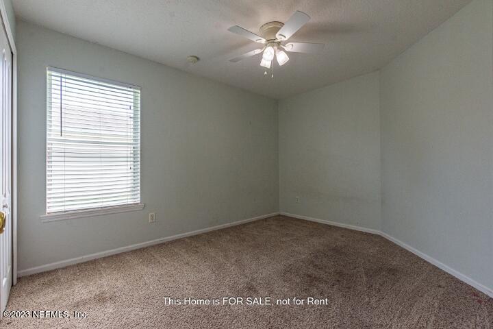 10329 Shelby Creek Road South Jacksonville, FL 32221 - Photo 27 of 41 an empty room with a window