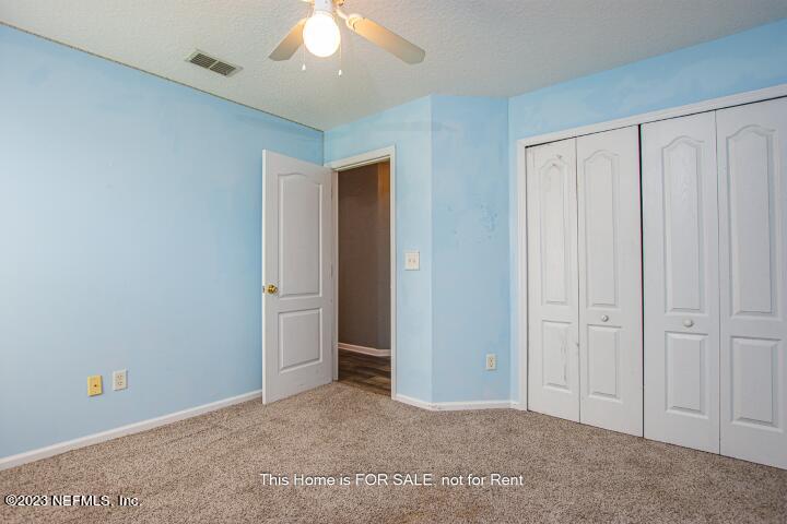 10329 Shelby Creek Road South Jacksonville, FL 32221 - Photo 33 of 41 an empty room with closet area