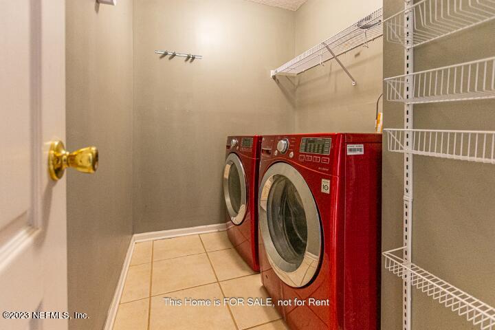 10329 Shelby Creek Road South Jacksonville, FL 32221 - Photo 35 of 41 a utility room with dryer and washer