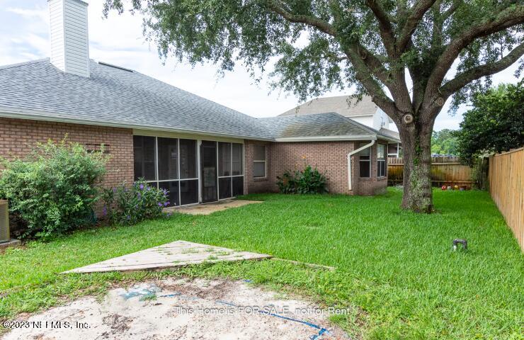 10329 Shelby Creek Road South Jacksonville, FL 32221 - Photo 39 of 41 a view of a house with a yard