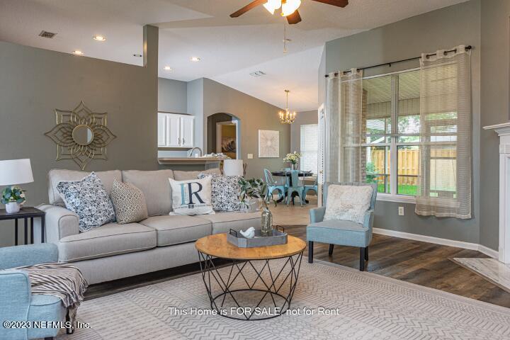 10329 Shelby Creek Road South Jacksonville, FL 32221 - Photo 6 of 41 a living room with furniture and a large window