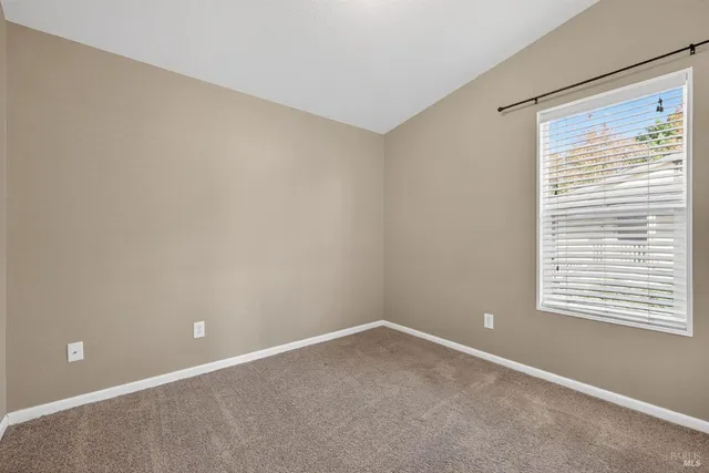 a view of a swimming pool with a lounge chairs