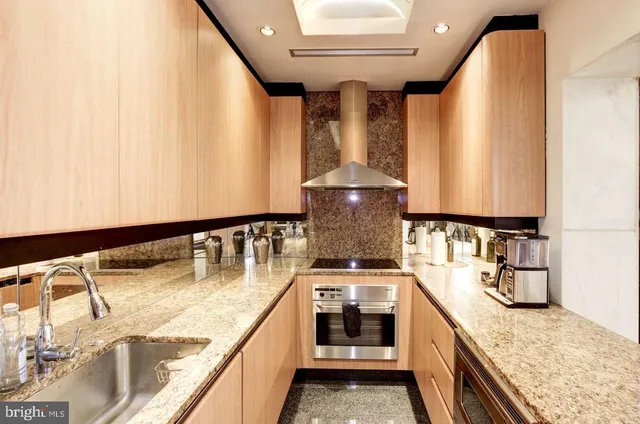 a kitchen with a stove and a white refrigerator