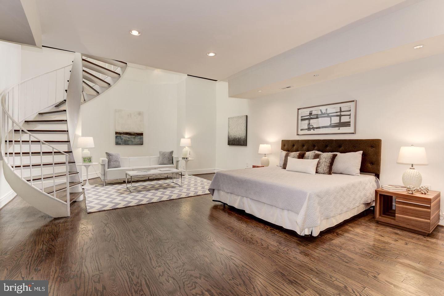 1715 15th Street Northwest, Unit 5 Washington, DC 20009 - Photo 16 of 34 a spacious bedroom with a bed and a view of living room