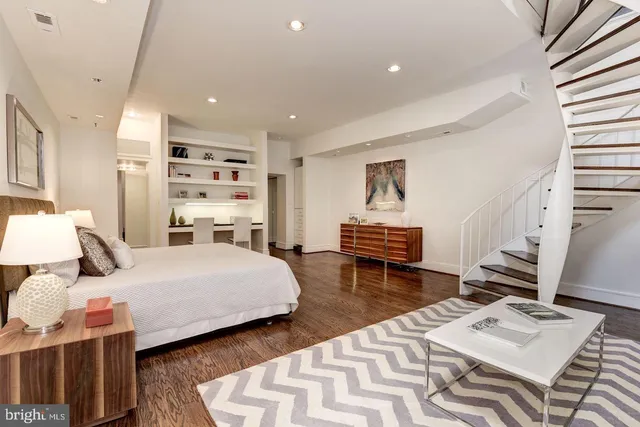 a dining room with furniture and wooden floor