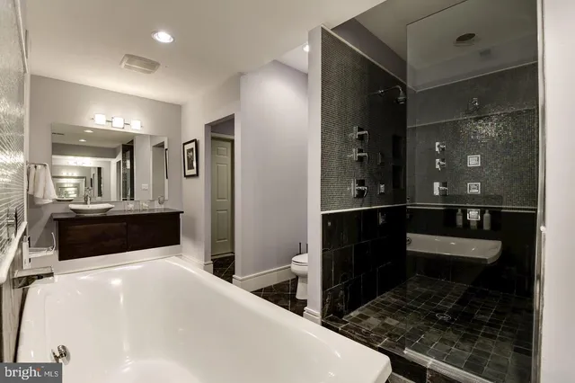 a large white kitchen with a large window