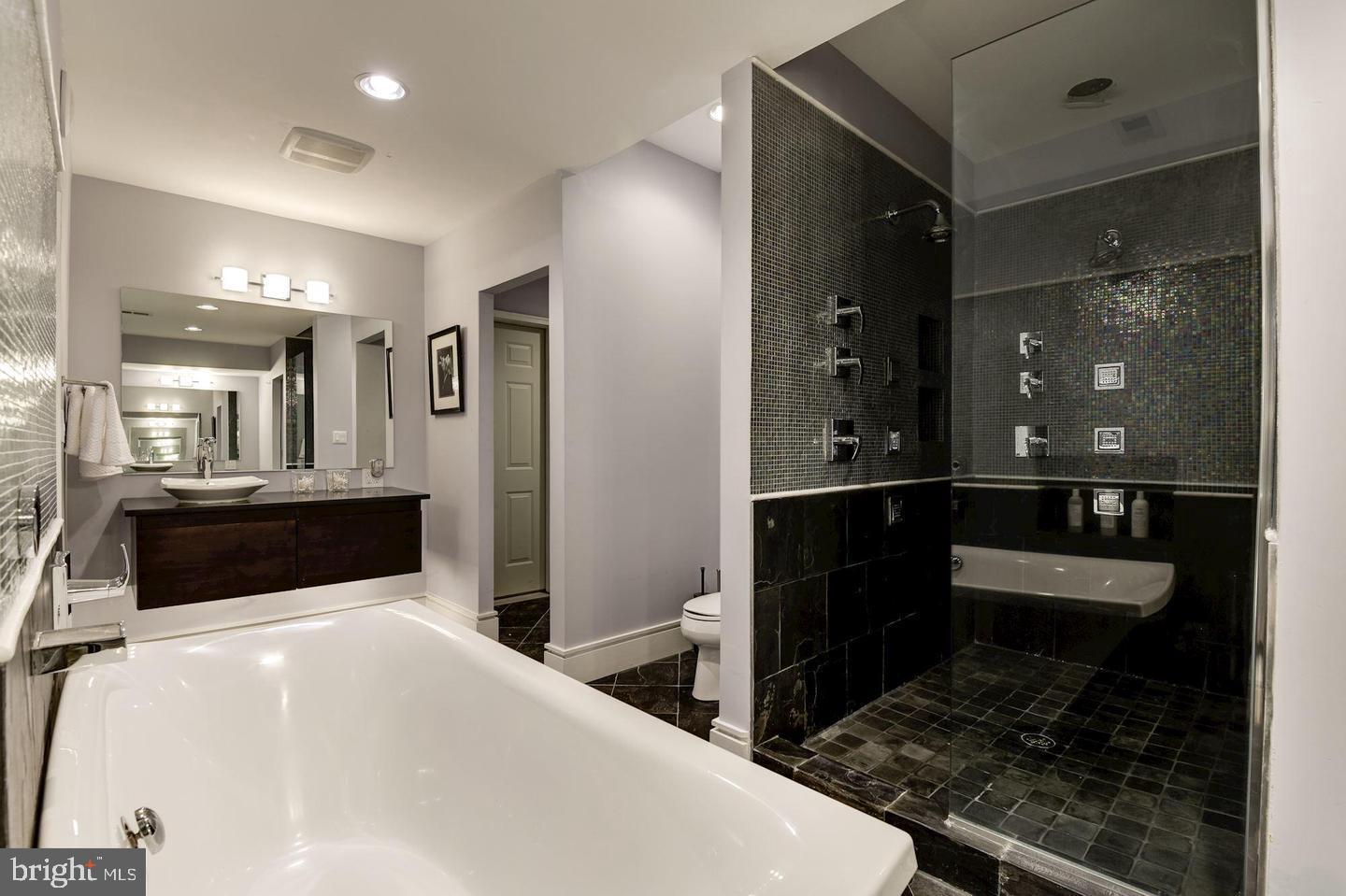 1715 15th Street Northwest, Unit 5 Washington, DC 20009 - Photo 20 of 34 a bathroom with a sink a toilet and shower
