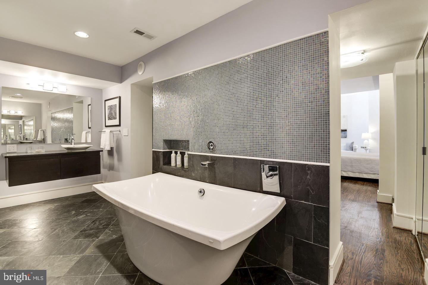 1715 15th Street Northwest, Unit 5 Washington, DC 20009 - Photo 21 of 34 a large white kitchen with a large window
