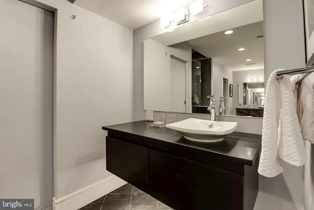 a view of kitchen island a sink and living room