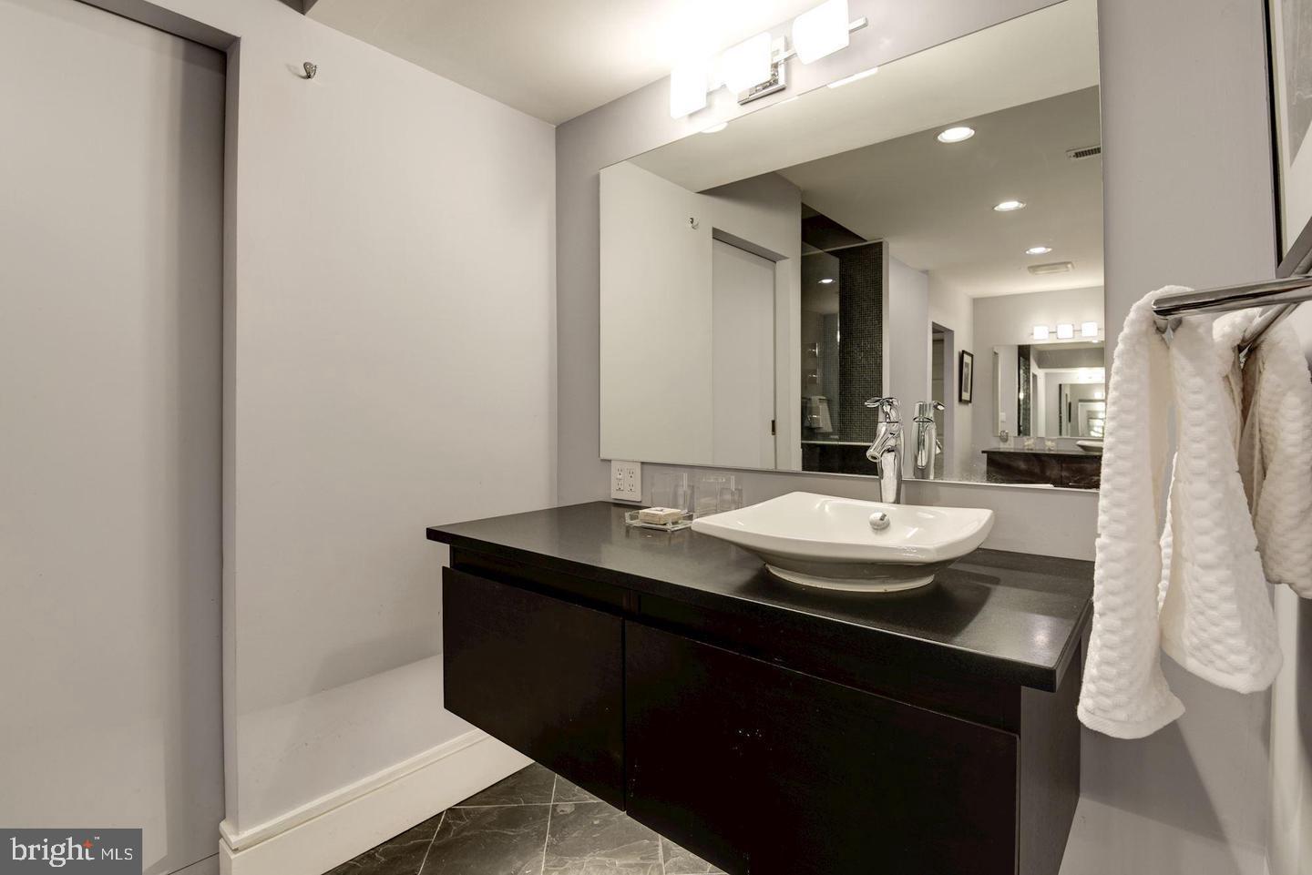 1715 15th Street Northwest, Unit 5 Washington, DC 20009 - Photo 22 of 34 a bathroom with a sink and a mirror