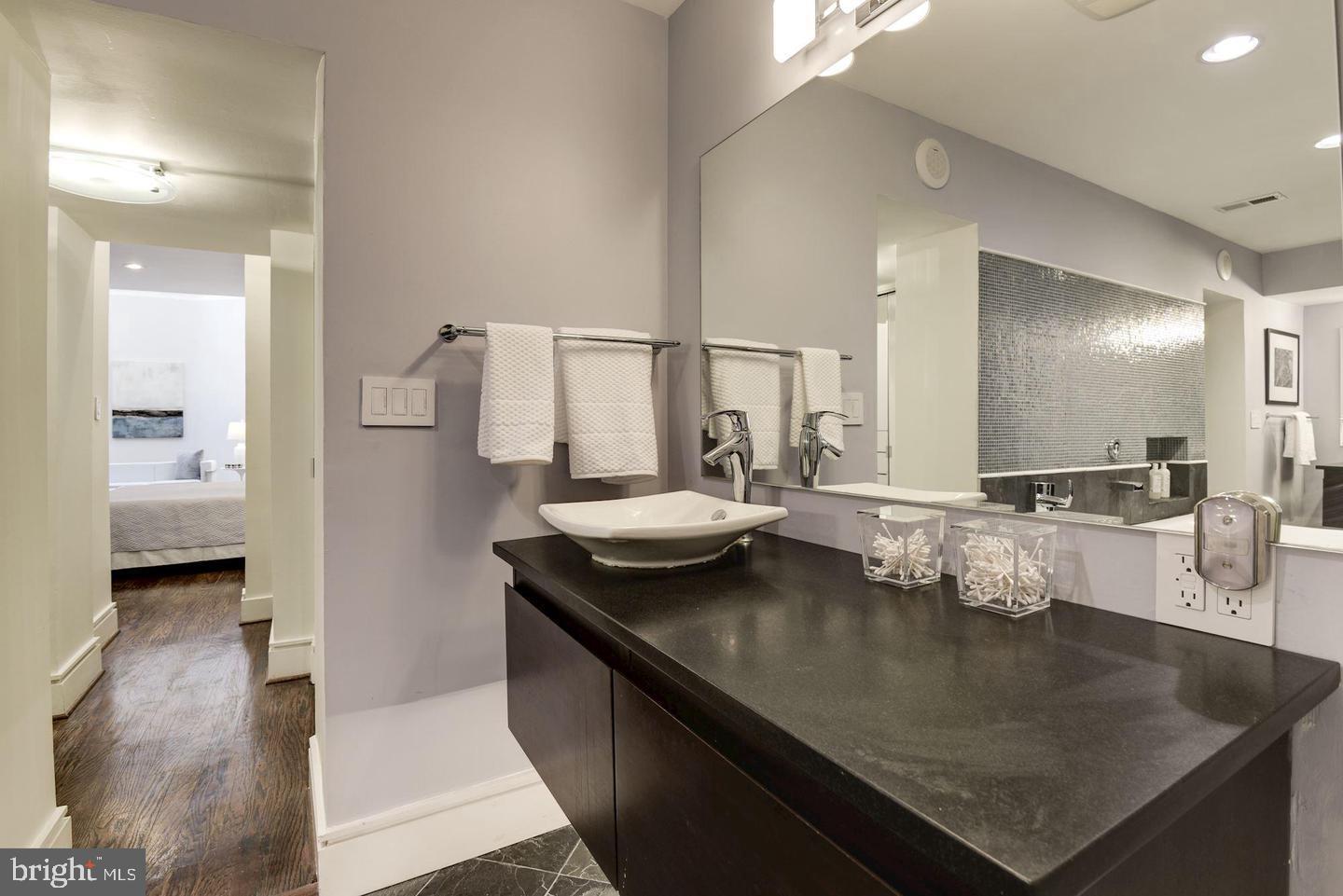 1715 15th Street Northwest, Unit 5 Washington, DC 20009 - Photo 23 of 34 a view of kitchen island a sink and living room