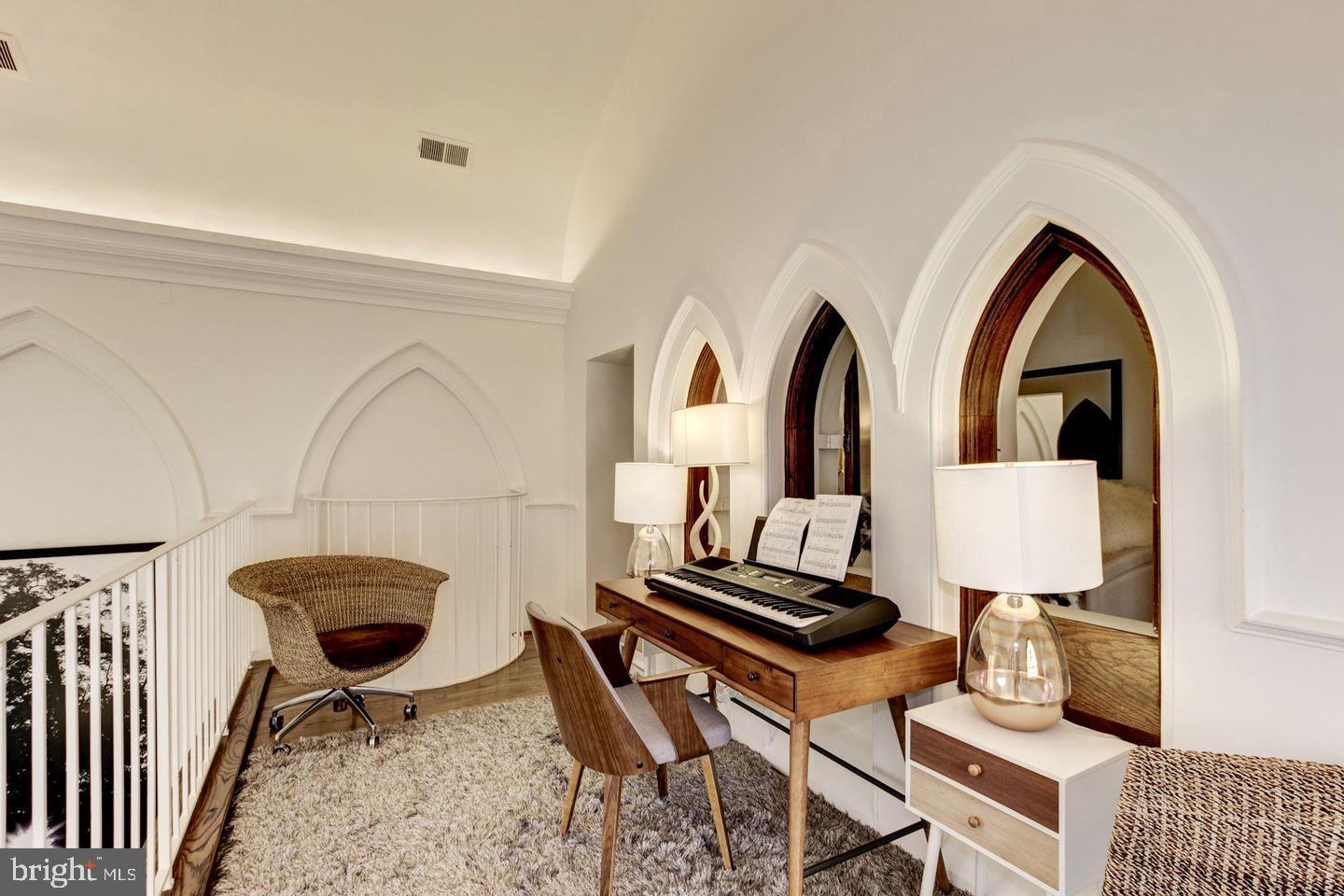 1715 15th Street Northwest, Unit 5 Washington, DC 20009 - Photo 26 of 34 a living room with a table and chairs