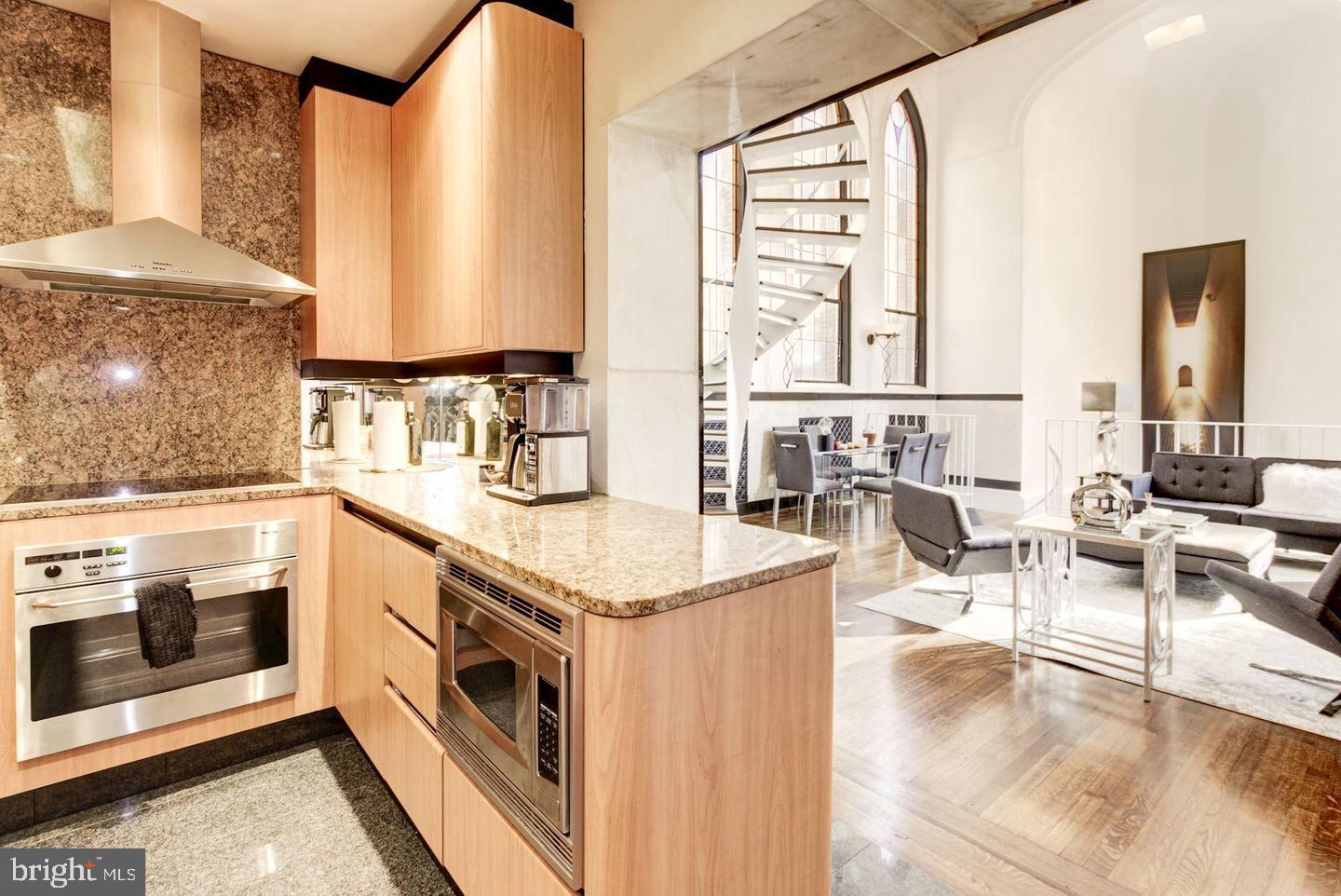 1715 15th Street Northwest, Unit 5 Washington, DC 20009 - Photo 10 of 34 a kitchen with stainless steel appliances granite countertop a stove and a sink