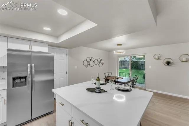 a kitchen with a sink appliances and cabinets