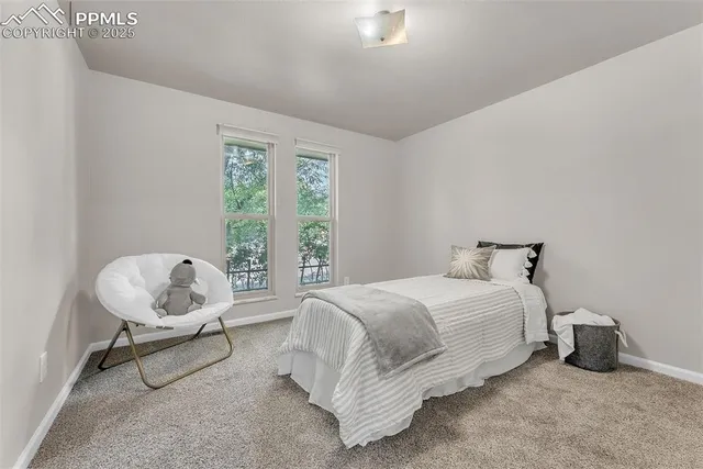 a bedroom with a bed and chair