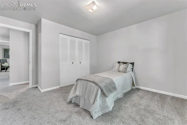 a bedroom with a bed and a cabinets