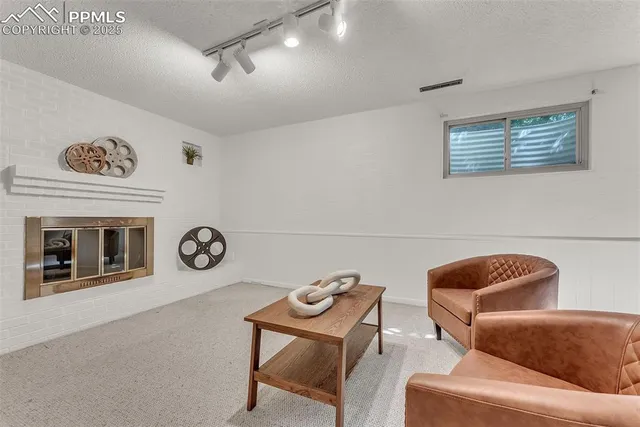a living room with furniture and a chair