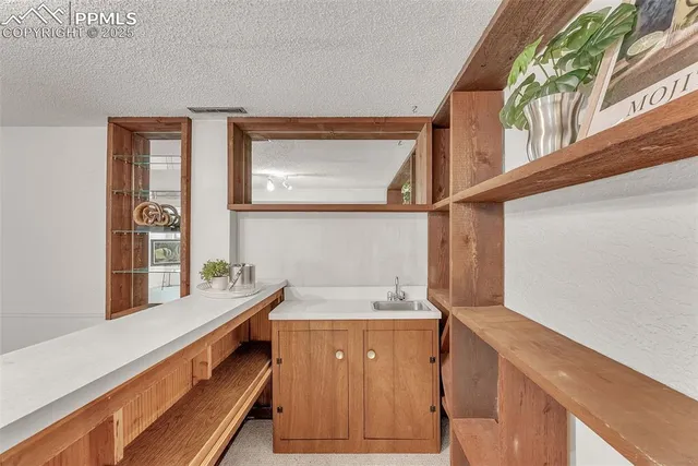 a bathroom with a sink and a window