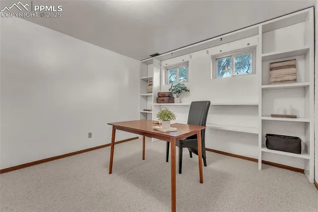 a workspace with furniture and a window