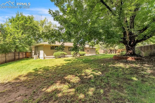 a backyard of a house with lots of green space