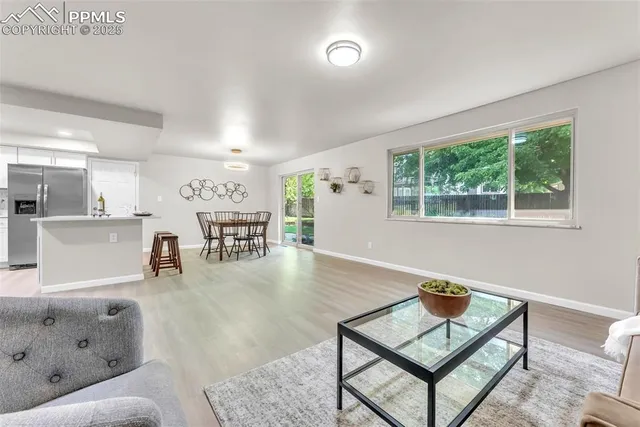 a living room with furniture and a table