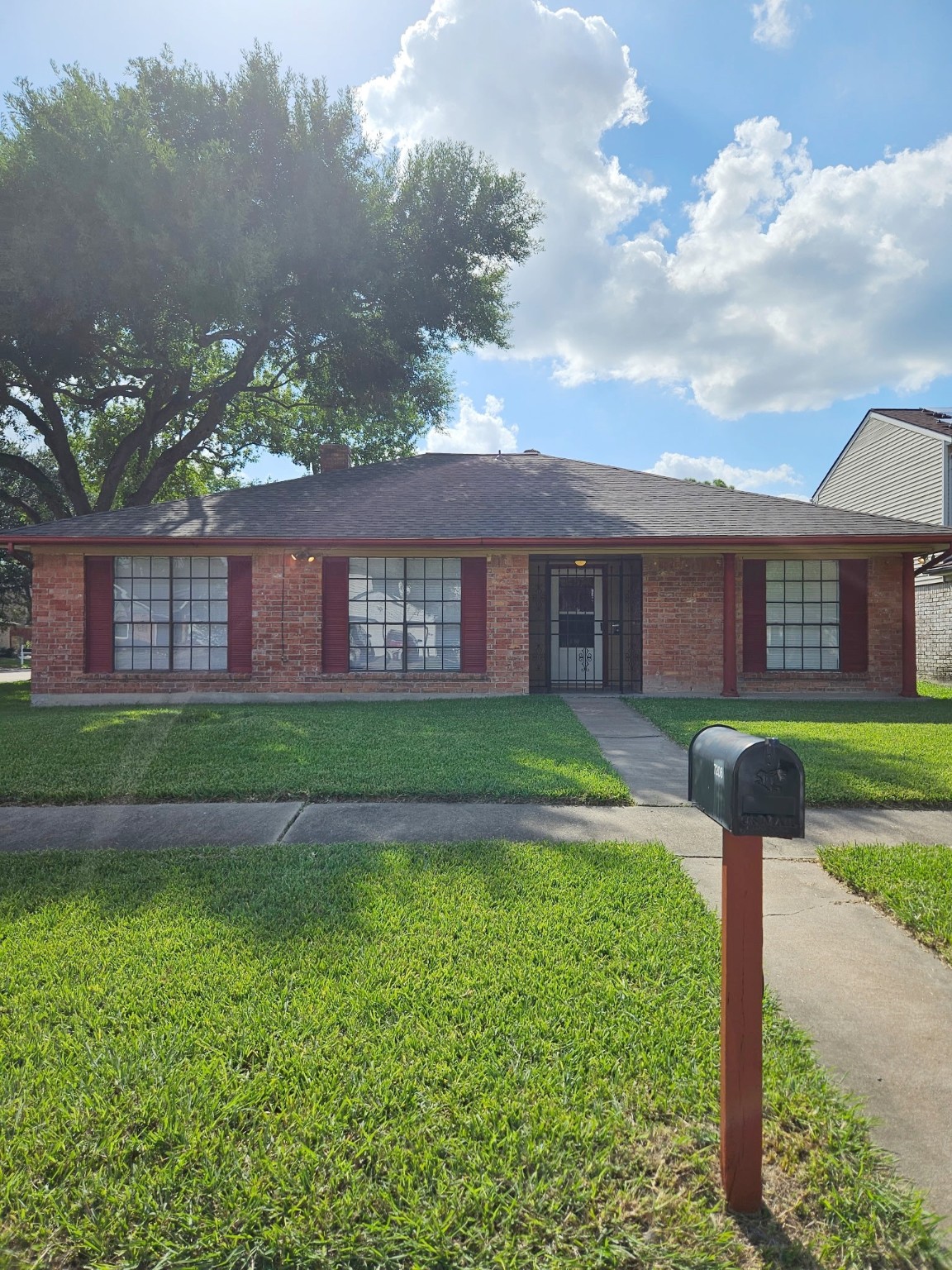 7206 Navidad Road Houston, TX 77083 - Photo 2 of 48 a front view of a house with a yard