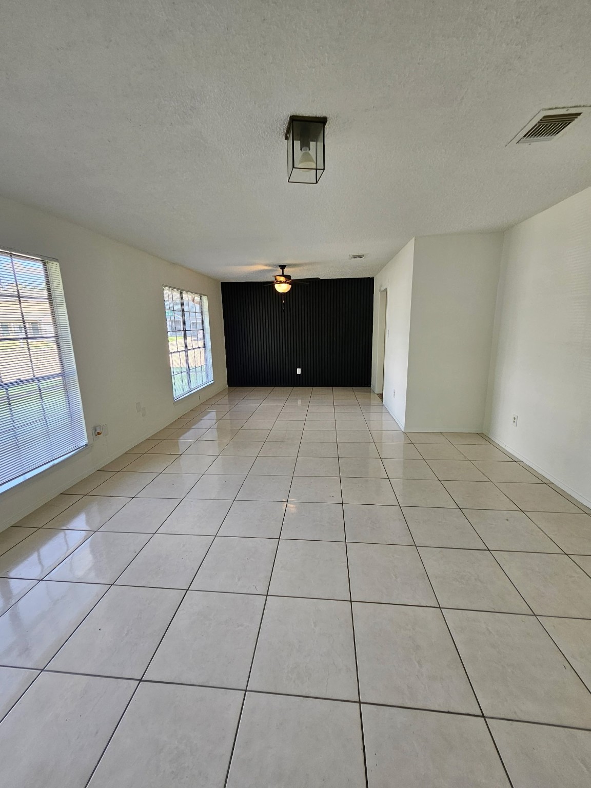 7206 Navidad Road Houston, TX 77083 - Photo 26 of 48 a view of empty room with kitchen and window