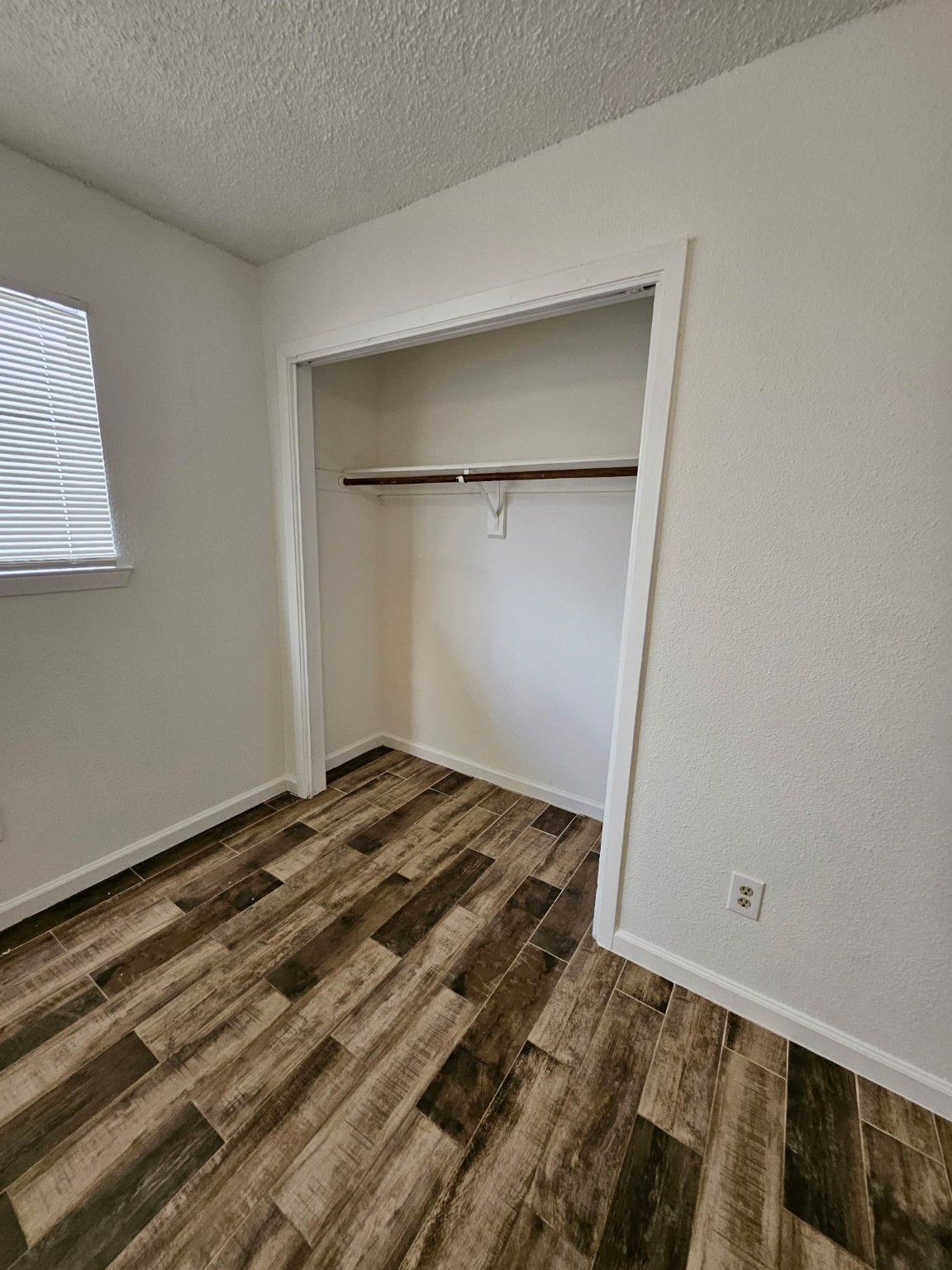 7206 Navidad Road Houston, TX 77083 - Photo 33 of 48 a view of a room with wooden floor and closet
