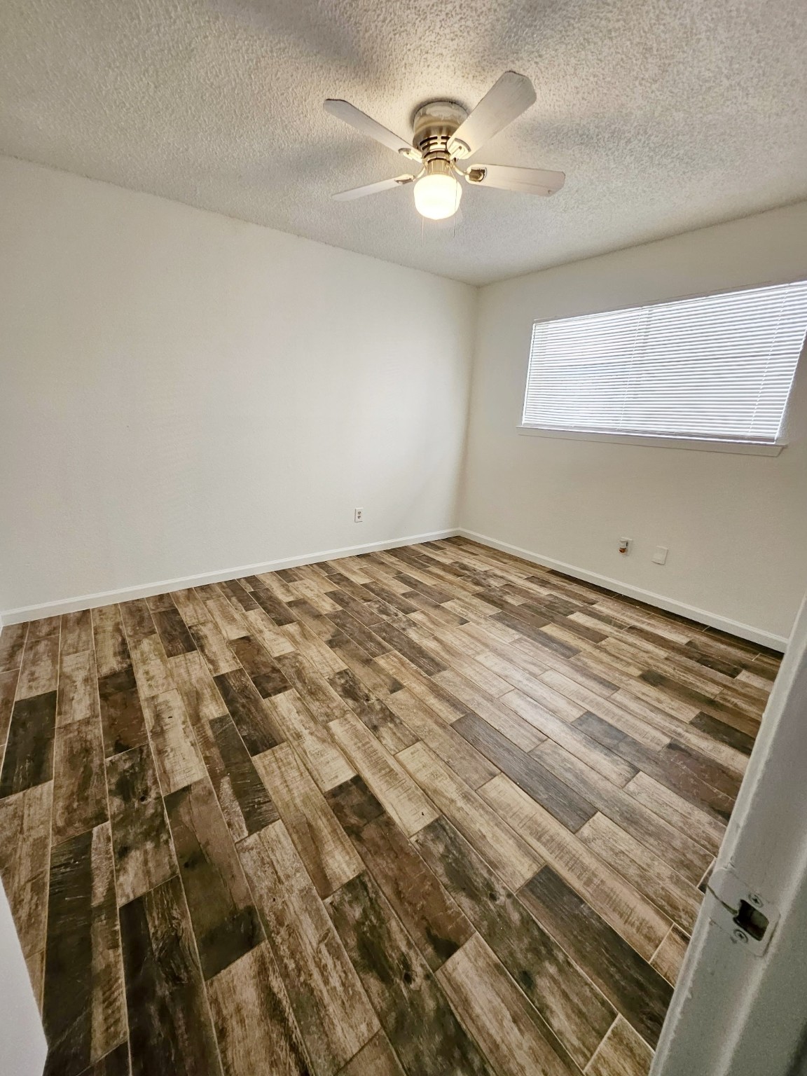 7206 Navidad Road Houston, TX 77083 - Photo 34 of 48 a view of a bedroom with a bed
