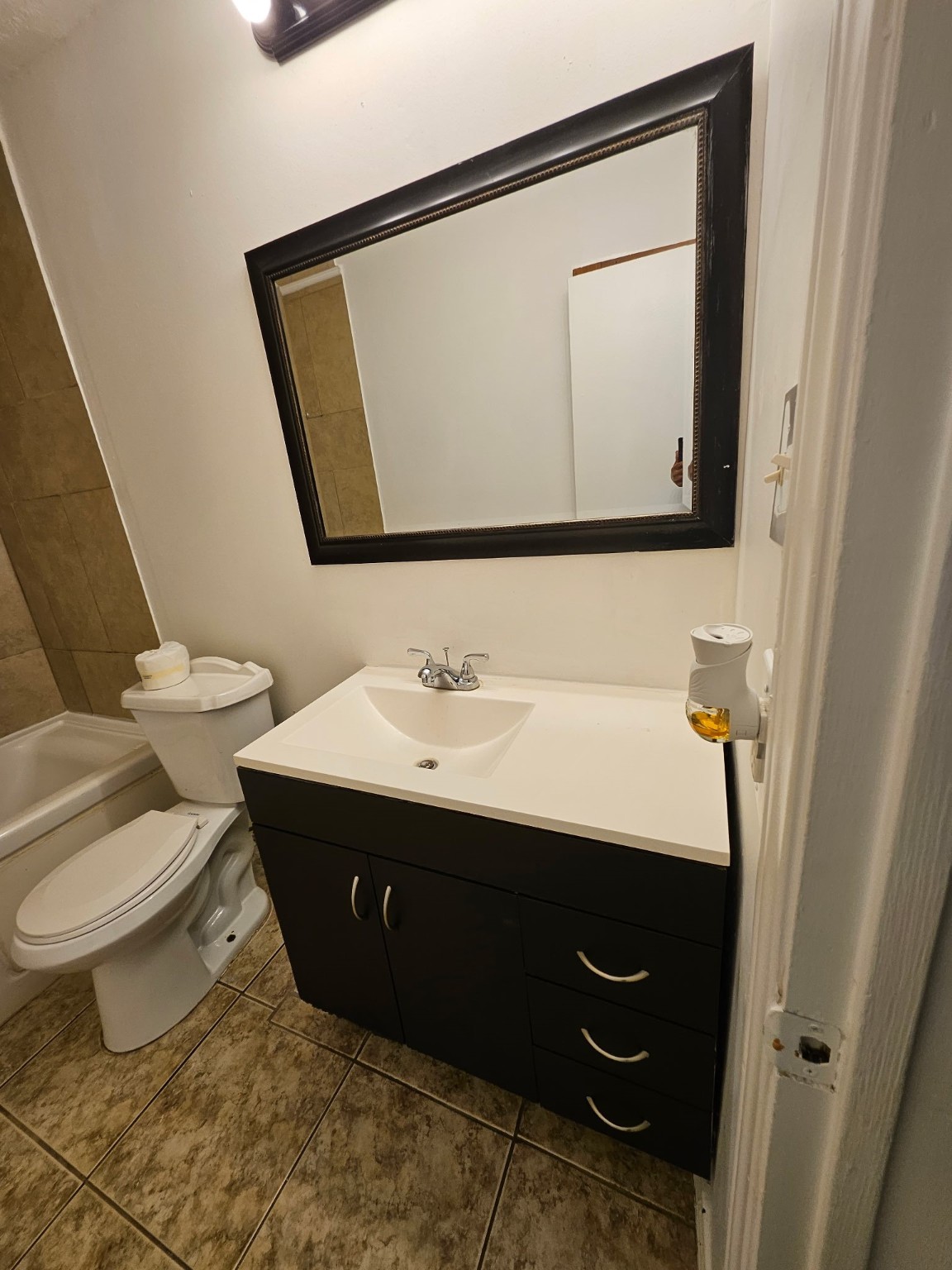 7206 Navidad Road Houston, TX 77083 - Photo 37 of 48 a bathroom with a sink toilet and mirror