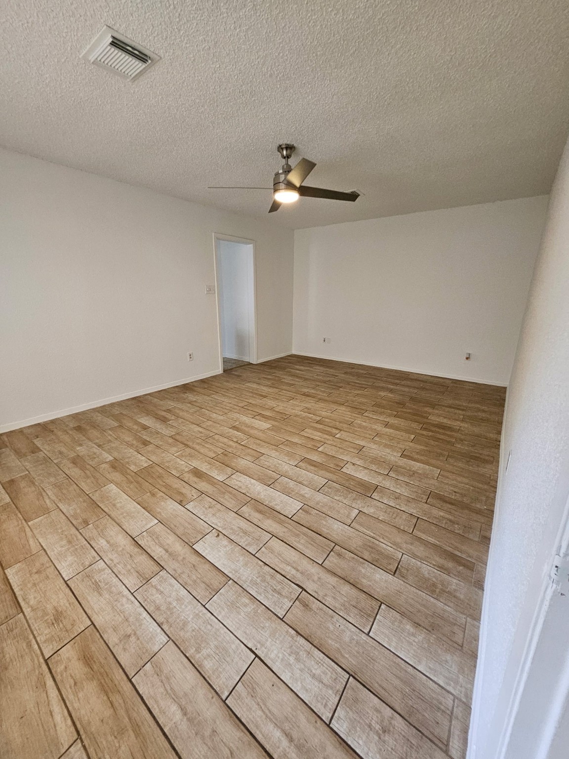 7206 Navidad Road Houston, TX 77083 - Photo 40 of 48 a view of empty room with ceiling fan
