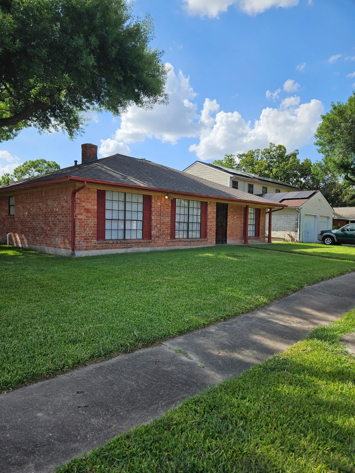 7206 Navidad Road Houston, TX 77083 - Photo 5 of 48 a view of a house with a yard and a porch