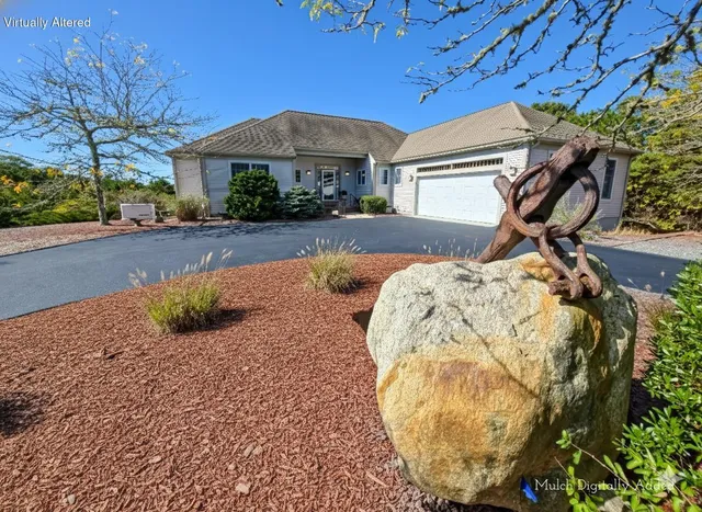 a view of a house with a street