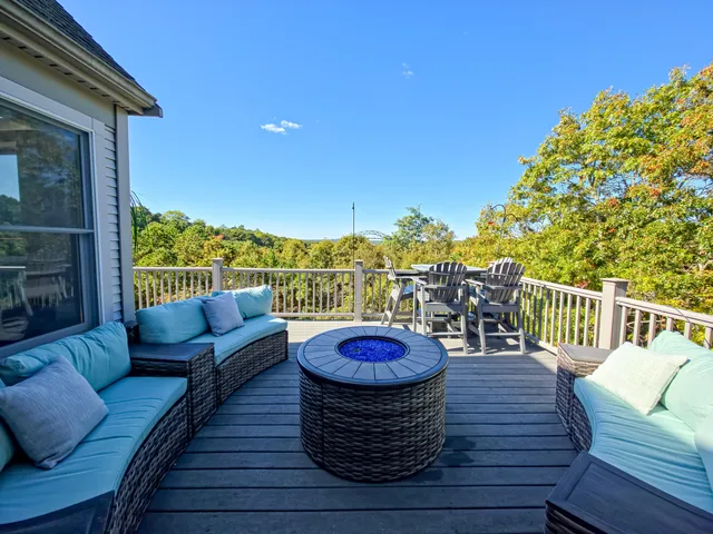 a bedroom with a bed and dresser next to a window