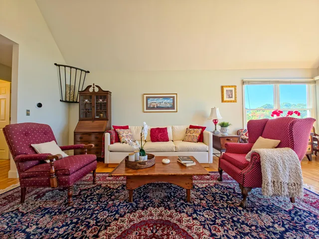 a bedroom with a bed and a table