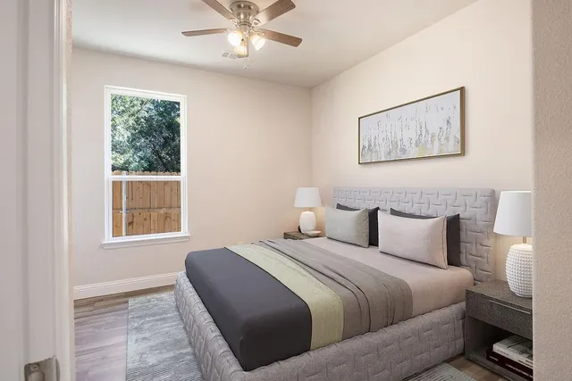 a bedroom with a bed and a window