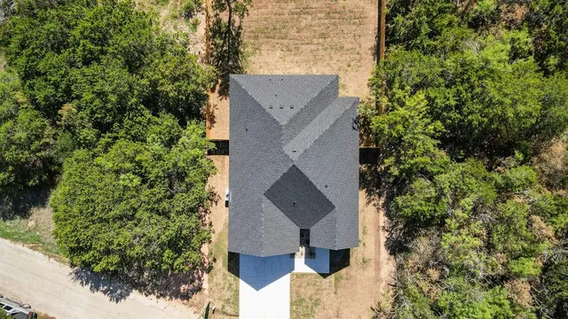 an aerial view of houses with yard