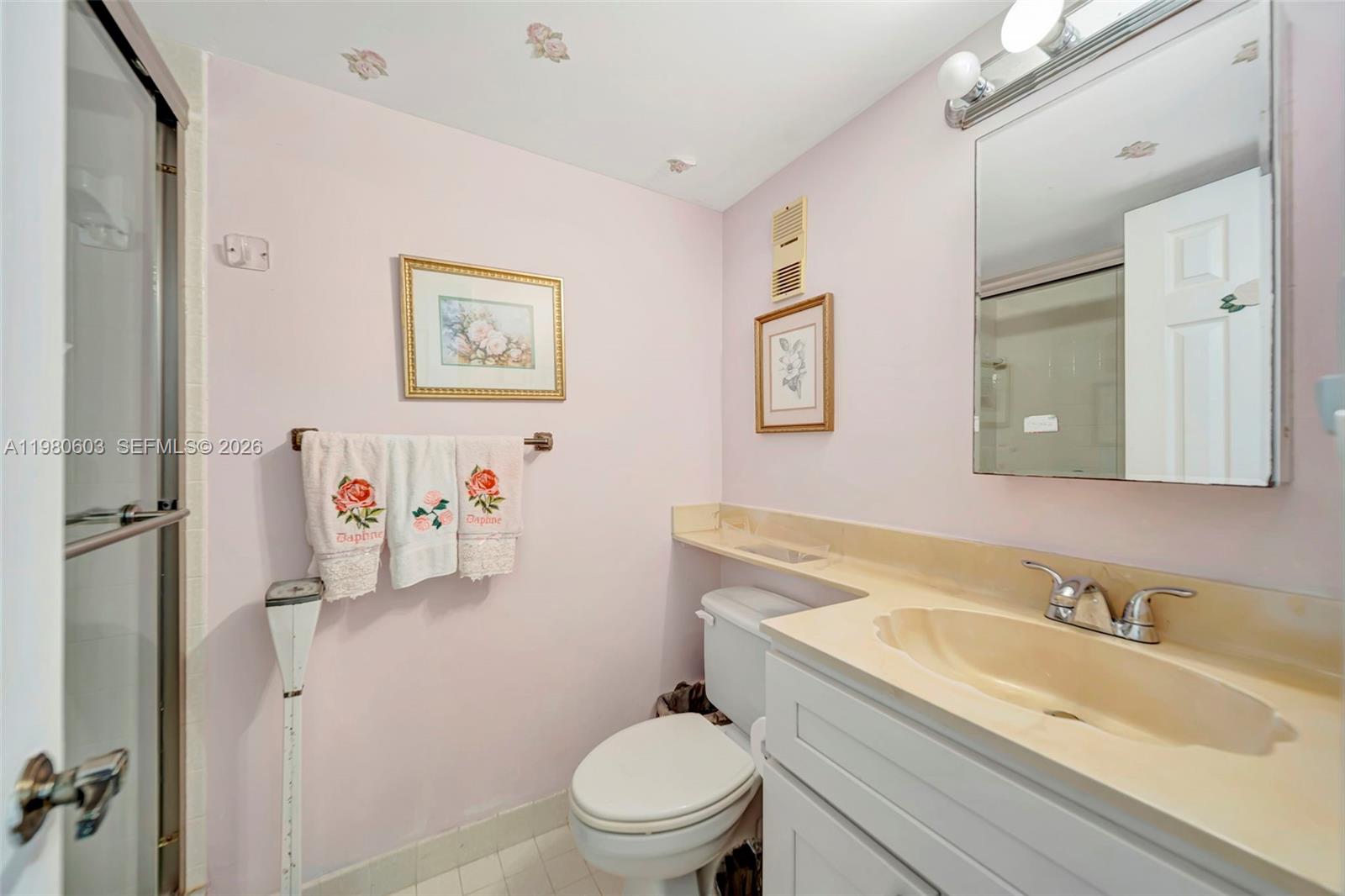 3940 Inverrary Boulevard, Unit 303A Lauderhill, FL 33319 - Photo 15 of 28 a bathroom with a granite countertop sink mirror vanity and toilet