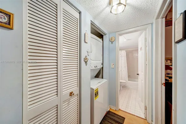 a view of a hallway with closet and entryway