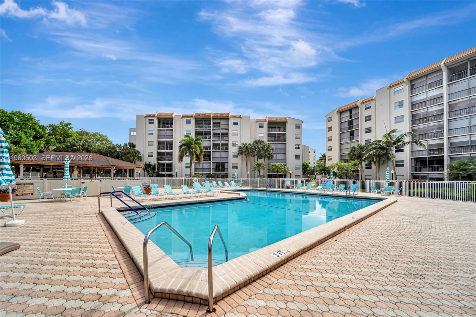 3940 Inverrary Boulevard, Unit 303A Lauderhill, FL 33319 - Photo 20 of 28 a view of a swimming pool with a patio