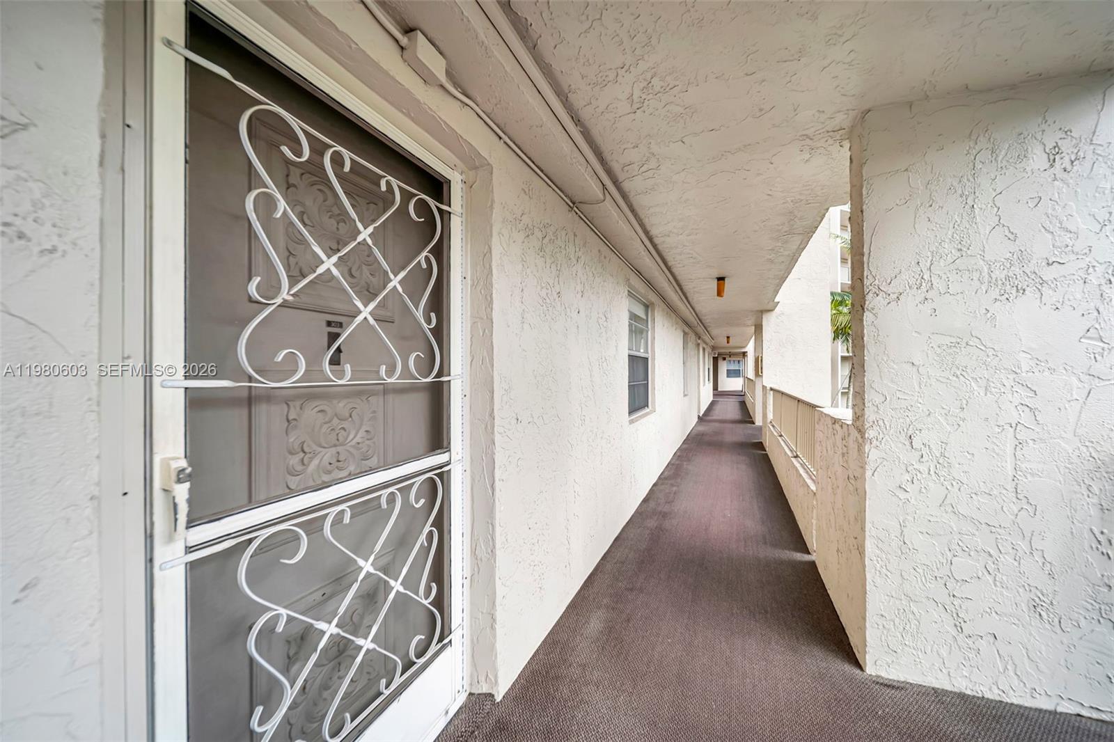 3940 Inverrary Boulevard, Unit 303A Lauderhill, FL 33319 - Photo 28 of 28 a view of an entryway with wooden floor