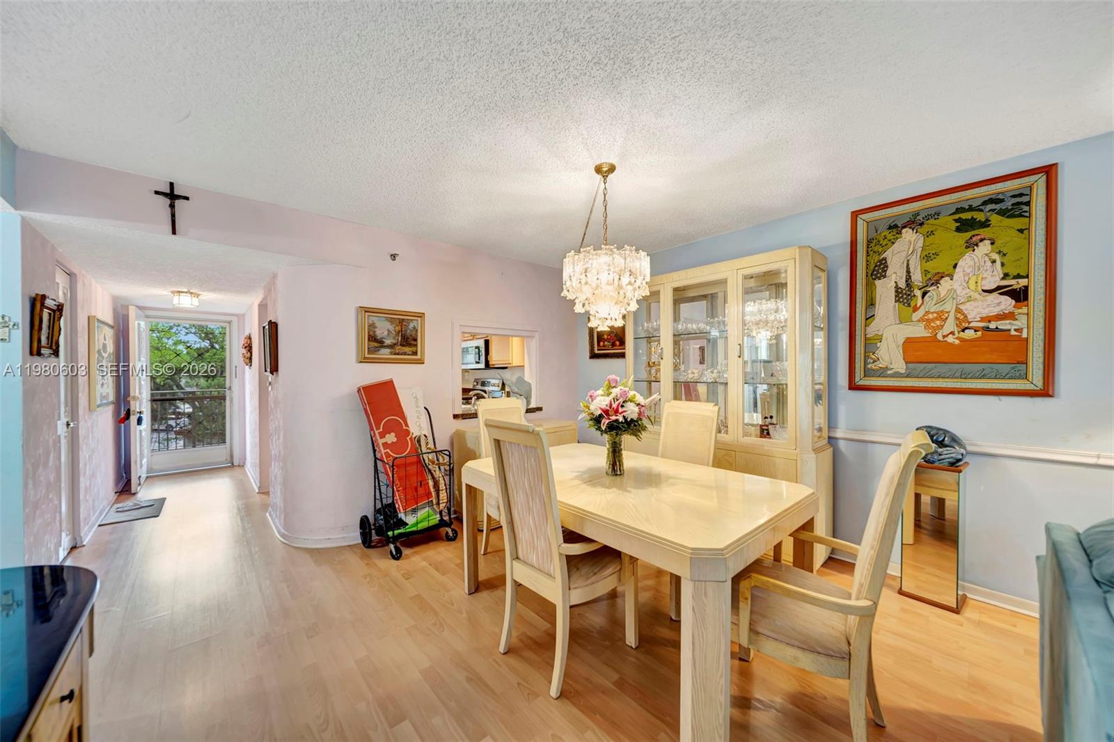3940 Inverrary Boulevard, Unit 303A Lauderhill, FL 33319 - Photo 8 of 28 a view of a dining room with furniture and wooden floor