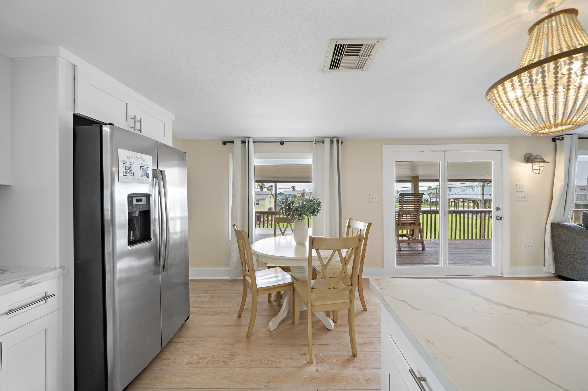 417 Olive Street Surfside Beach, TX 77541 - Photo 16 of 46 a view of a dining room with furniture window and outside view