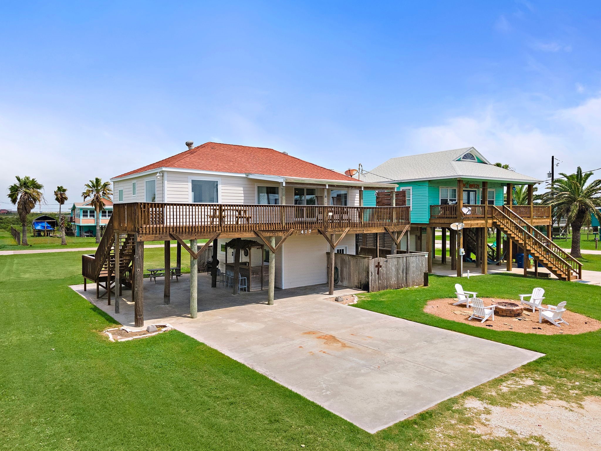 417 Olive Street Surfside Beach, TX 77541 - Photo 2 of 46 a front view of a house with garden