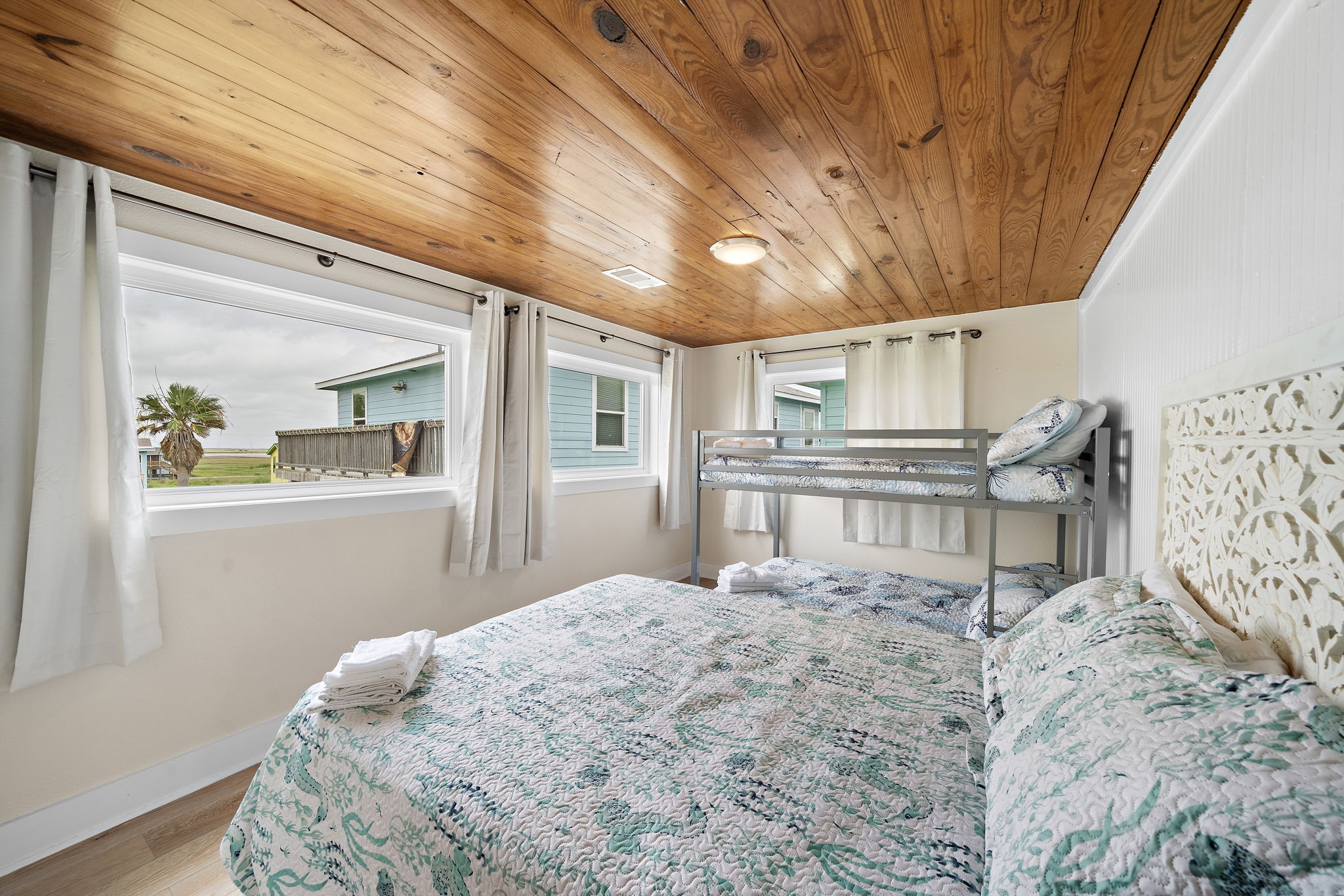 417 Olive Street Surfside Beach, TX 77541 - Photo 27 of 46 a bedroom with a bed dresser and a window