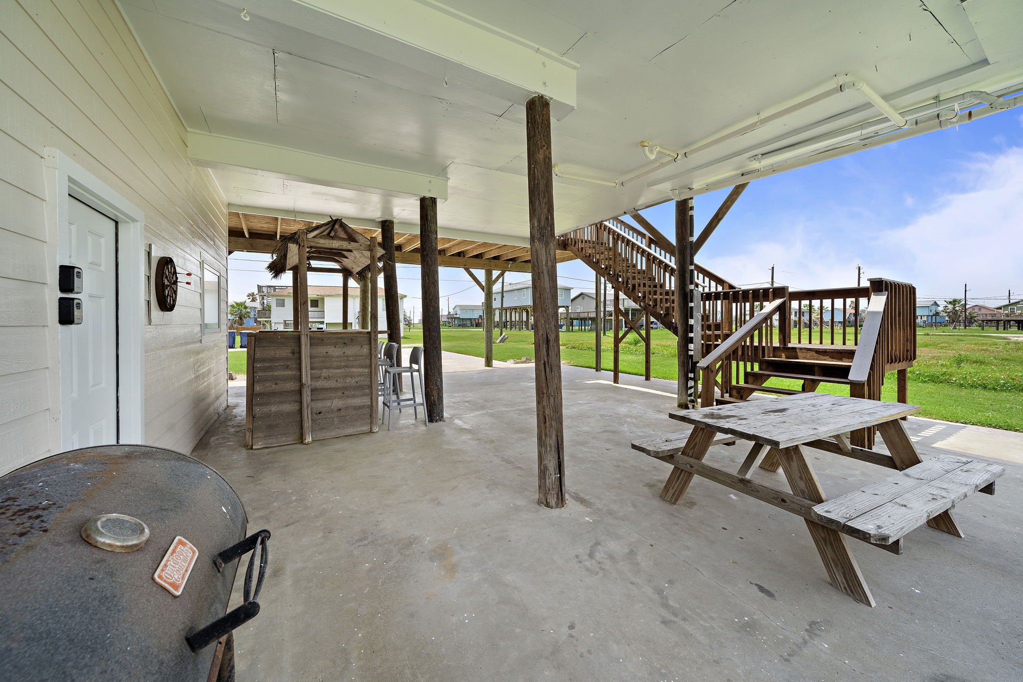 417 Olive Street Surfside Beach, TX 77541 - Photo 32 of 46 a living room with furniture and a wooden floor