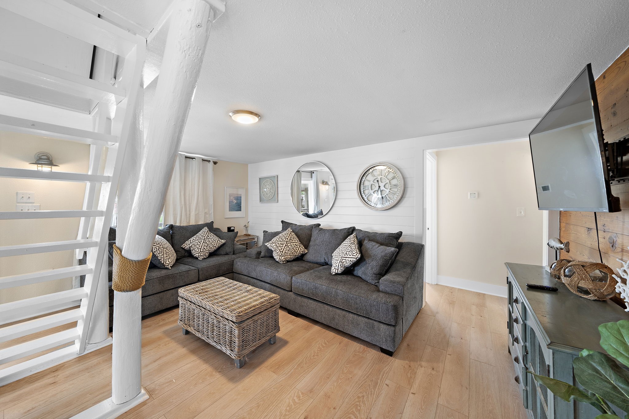 417 Olive Street Surfside Beach, TX 77541 - Photo 5 of 46 a living room with furniture and a flat screen tv